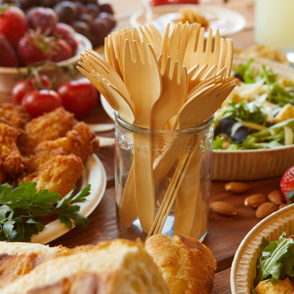 Wooden forks in a glass bottle